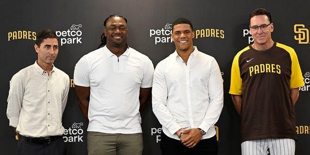 Juan Soto #22 of the San Diego Padres, (2nd R), stands alongside manager Bob Melvin, right, president and general manager A.J. Preller, left, and Josh Bell #19 during a news conference held to introduce them to the team Aug. 3, 2022 at Petco Park in San Diego, California.