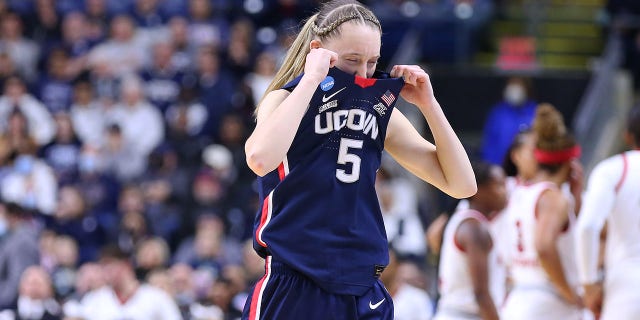 UConn Huskies guard Paige Bueckers (5) reacts after witnessing an injury to UConn Huskies forward Dorka Juhasz during an Elite Eight women's NCAA baskeball tournament game between the UConn Huskies and N.C. State Wolfpack March 28, 2022, at Total Mortgage Arena in Bridgeport, Conn.