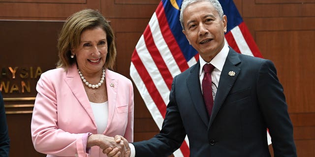 U.S. House Speaker Nancy Pelosi, left, meets with Malaysia Parliament speaker Azhar Azizan Harun at the parliament house in Kuala Lumpur, Tuesday, Aug. 2, 2022. Pelosi arrived in Malaysia on Tuesday for the second leg of an Asian tour that has been clouded by an expected stop in Taiwan, which would escalate tensions with Beijing. 