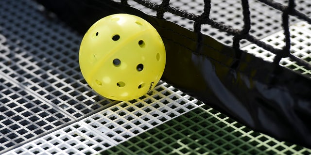 A plastic pickleball