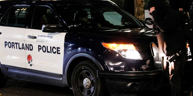 portland police cruiser at night 