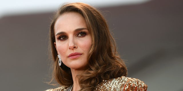 Natalie Portman wears gold dress