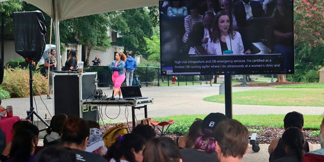 Supporters of abortion rights gather to watch the South Carolina Senate Medical Affairs Committee hearing on abortion outside the statehouse, Wednesday, Aug. 17, 2022, in Columbia, S.C.