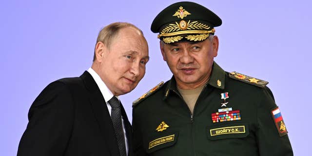 Russian President Vladimir Putin, left, vows to strengthen Russia's military cooperation with its allies during the Army 2022 International Military and Technical Forum at Patriot Park, outside Moscow, Russia, on Aug. 15, 2022.