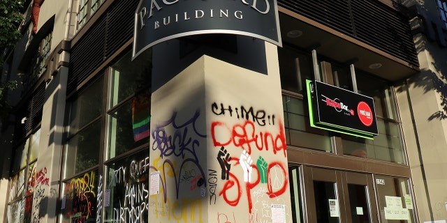 The Packard Building, an apartment building inside Seattle's so-called Capitol Hill Autonomous Zone, is seen damaged and vandalized in June 2020. Residents of the building appealed to city officials for assistance in the absence of a functioning law enforcement presence.