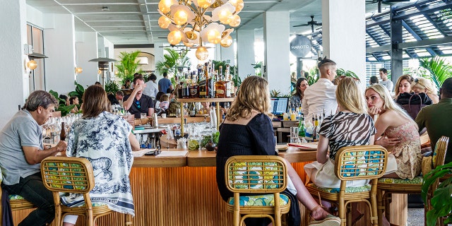 A busy dining scene in Bal Harbour, Florida, in summer 2022.