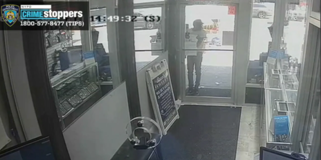 A suspect approached Rocco's Jewelry before opening the door for the rest of the thieves.