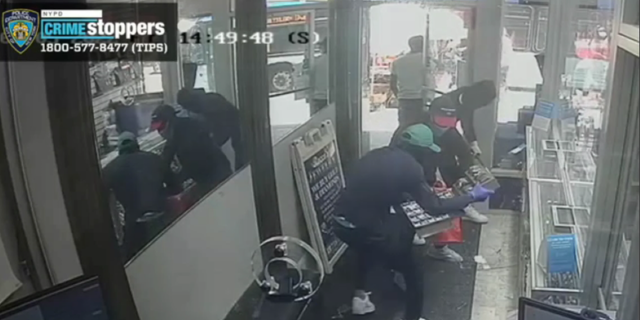 Criminals robbed a Bronx jewelry store and used a hammer to break open displays of fine diamonds.