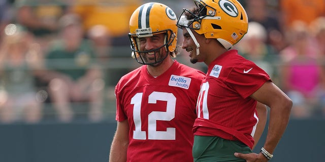 Aaron Rodgers, left, and Jordan Love of the Green Bay Packers work out during training camp at Ray Nitschke Field in Ashwaubenon, Wisconsin, on July 29, 2021.
