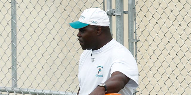 Running backs coach James Saxon works with James Aldridge of the Miami Dolphins on blocking drills during rookie minicamp May 1, 2010, at the Miami Dolphins' training facility in Davie, Fla.