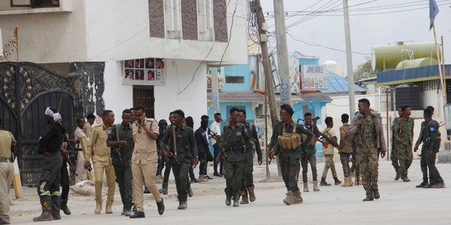 A soldier patrols outside the Hayat Hotel in Mogadishu, Somalia, Saturday Aug, 20, 2022. 