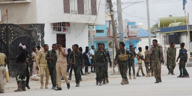 A soldier patrols outside the Hayat Hotel in Mogadishu, Somalia, Saturday Aug, 20, 2022. 