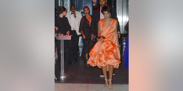 Beyoncé, Jay-Z and Solange Knowles are pictured leaving the Met Gala After Party at the Boom Boom Room in the Meatpacking district. Jay-Z appears to be holding his face.