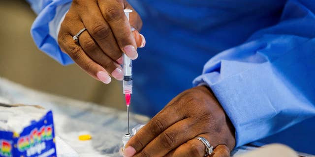 A dose of the monkeypox vaccine is loaded into a syringe by a medical worker at Westchester Medical Center in Valhalla, N.Y, on July 28, 2022.