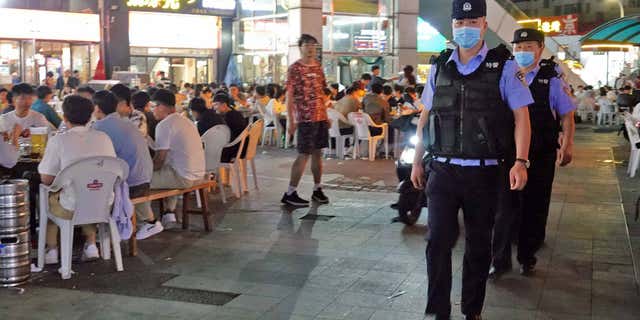 Tangshan City police officers, pictured here in the Laishan District of Yantai, East China's Shandong Province, on June 12, 2022, have increased security after a group of men violently assaulted four women at a barbeque restaurant in Tangshan City.