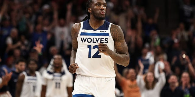 Taurean Prince #12 of the Minnesota Timberwolves watches after making a 3-point basket against the Memphis Grizzlies at the Target Center in Minneapolis, Minnesota, April 23, 2022. 