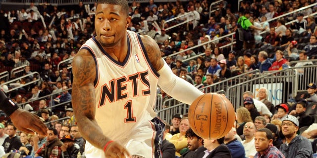Terrence WIlliams #1 of the New Jersey Nets drives against Stephen Jackson #1 of the Charlotte Bobcats on November 3, 2010 at the Prudential Center in Newark, New Jersey. 