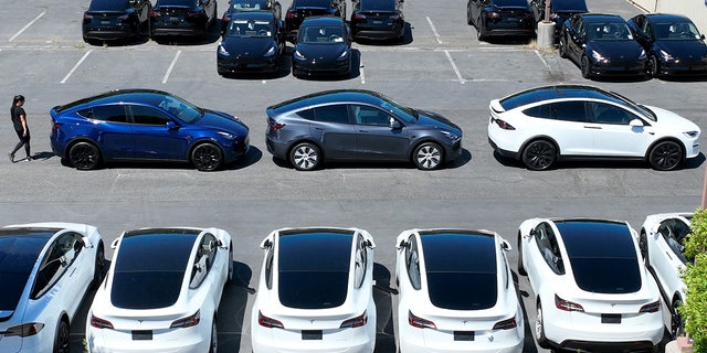 Tesla cars sit in a parking lot at a Tesla showroom on June 27 in Corte Madera, California.