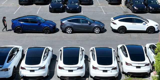 Tesla cars sit in a parking lot at a Tesla showroom on June 27 in Corte Madera, California.