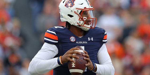 TJ Finley of the Auburn Tigers is hoping to pass the Alabama Crimson Tide in the first half at Jordan-Hare Stadium.  February 27, 2021 in Auburn, Alabama.