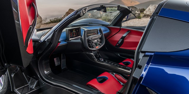 The Venom F5 features a yoke-style steering wheel.