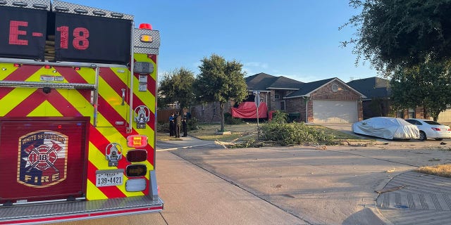 The driver lost control of the pickup truck, which was hauling a flatbed, and plowed through a neighbor's yard before crashing into the home, police said.