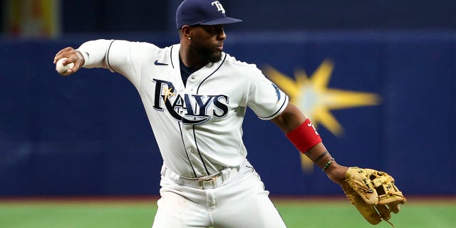 Yandy Diaz of the Tampa Bay Rays throws to first base after fielding a ground ball against the New York Yankees at Tropicana Field June 22, 2022, in St Petersburg, Fla.