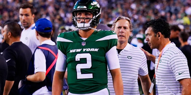 The New York Jets' Zach Wilson walks the sidelines after he was taken off the field after being injured during the first half of a preseason game against the Philadelphia Eagles Friday, Aug. 12, 2022, in Philadelphia.