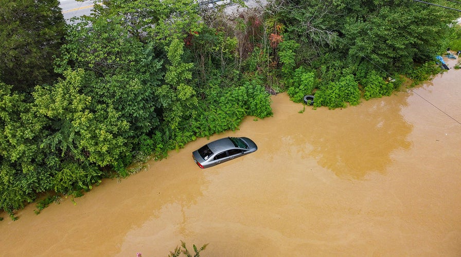 Helicopter rescues family trapped in attic amid flooding