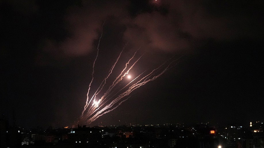 A pair of rockets and the smoke from other rockets 