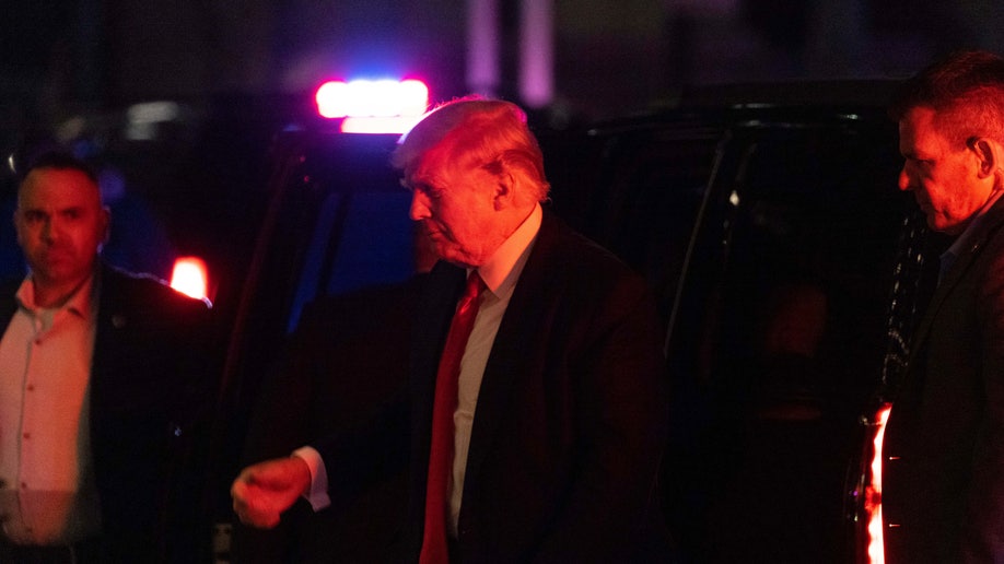 Donald Trump getting out of an SUV at Trump Tower in New York