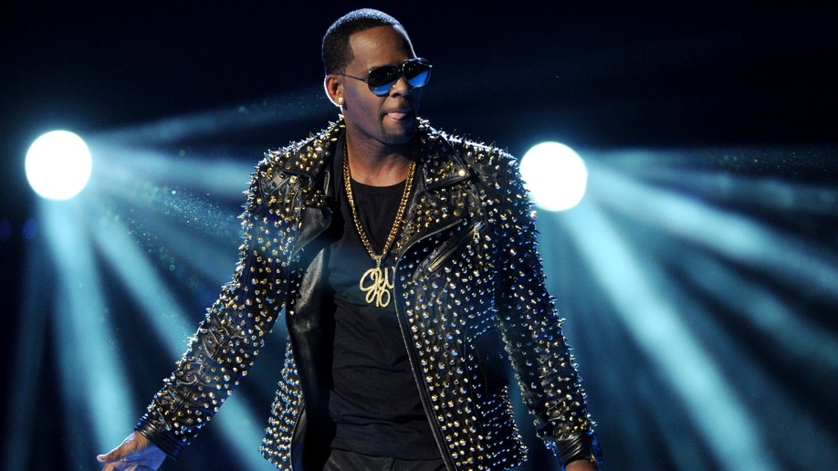 R. Kelly performs at the BET Awards in Los Angeles in a flashy coat