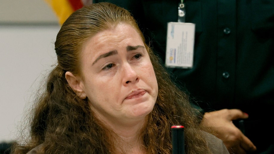 Danielle Woodard, the half-sister of Marjory Stoneman Douglas High School shooter Nikolas Cruz, becomes emotional as she testifies in the penalty phase of Cruz's trial at the Broward County Courthouse in Fort Lauderdale.