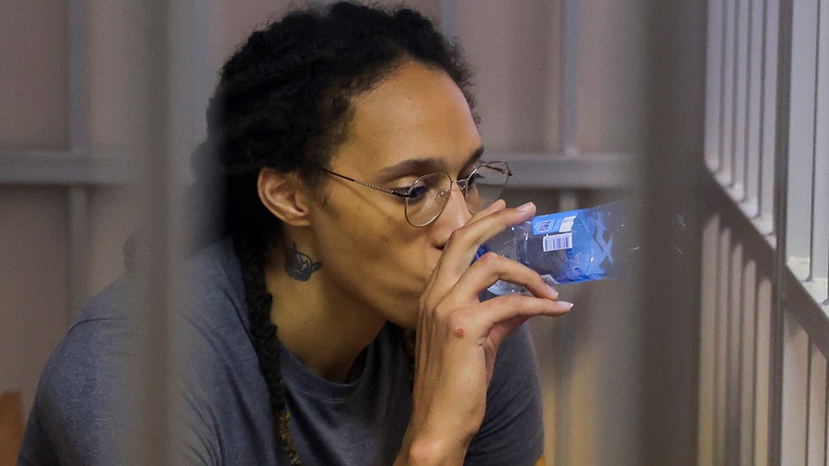 Brittney Griner drinks from a water bottle