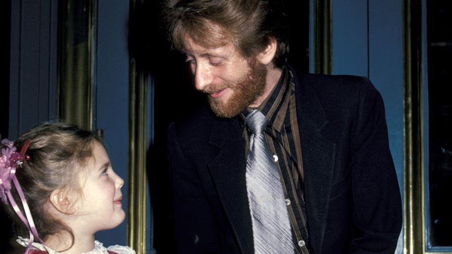 Young Drew Barrymore and her father, John Drew Barrymore, in 1983