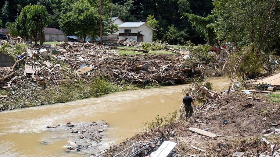 Search and Rescue units in Kentucky look around Troublesome Creek for multiple people still missing