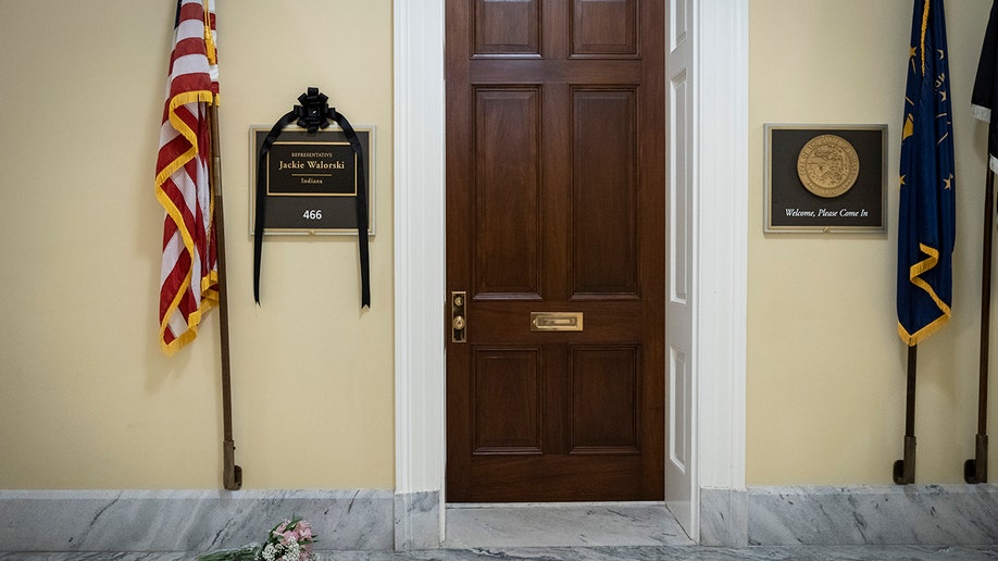 A photo of Rep. Jackie Walorski's office with a black ribbon over her name