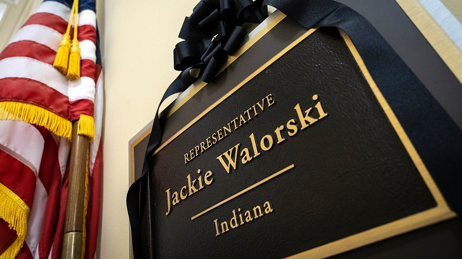 A black ribbon over the name plaque of Rep. Jackie Walorski 