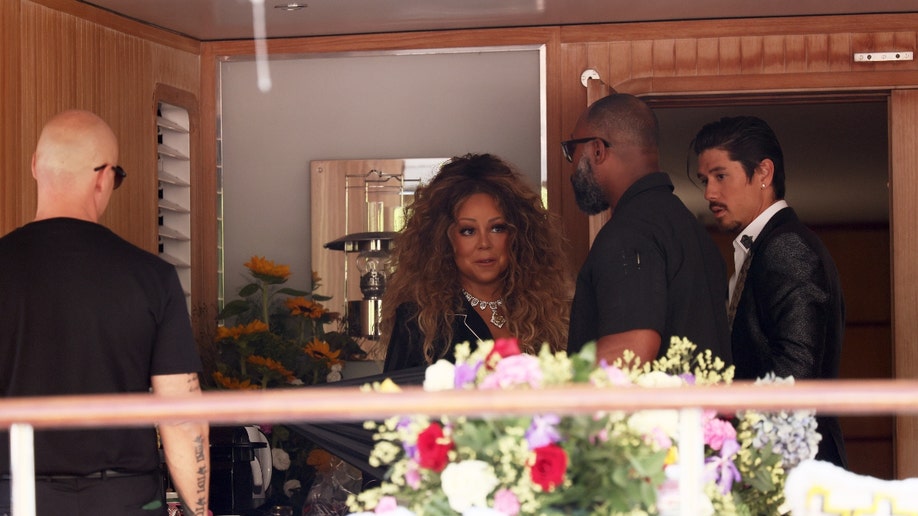 Mariah Carey in front of flowers in Sicily