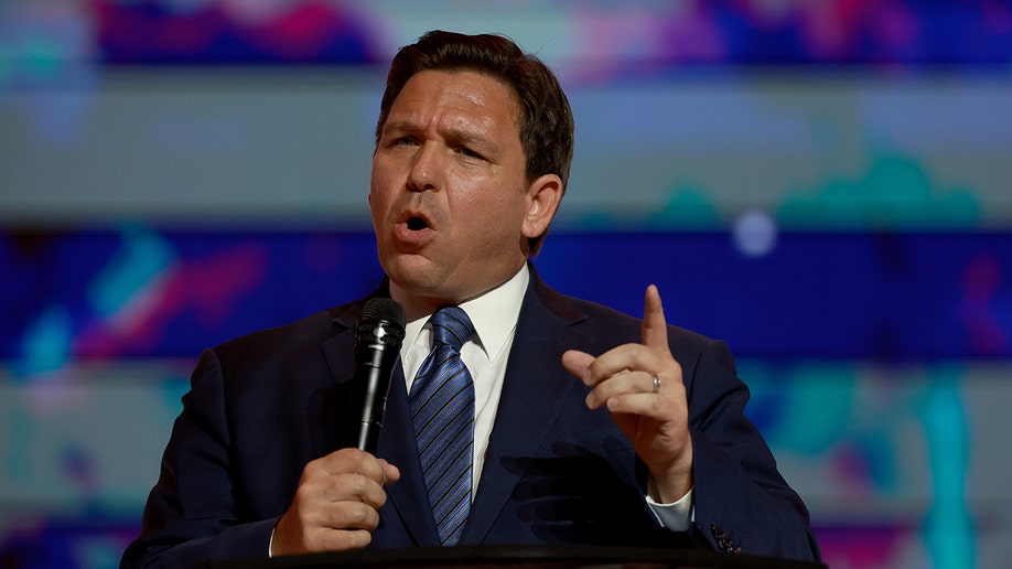 A close photo of Ron DeSantis with a microphone