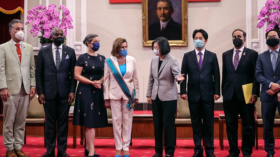Pelosi standing with the Taiwan president and several others
