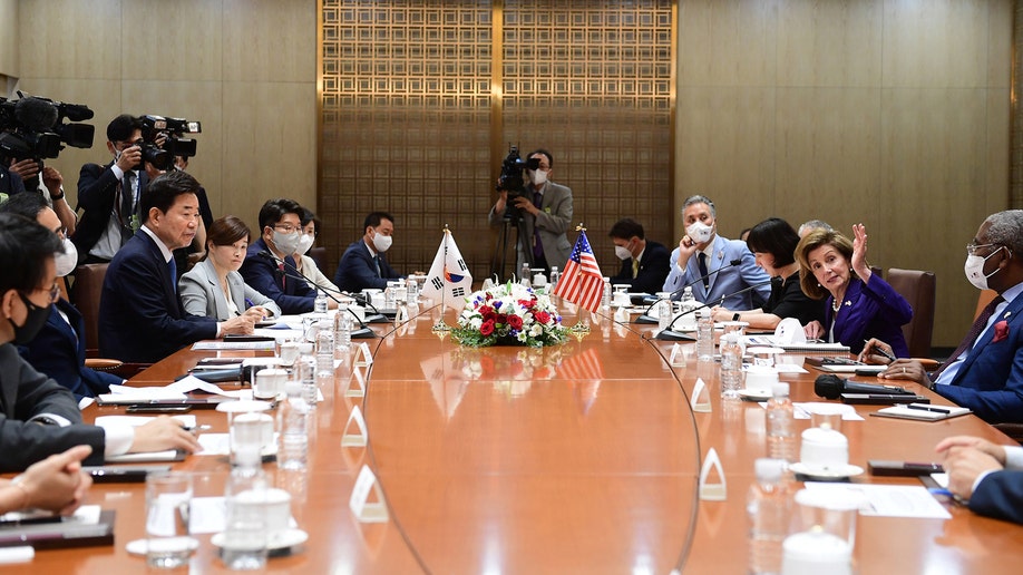 Speaker of the House Nancy Pelosi (D-CA) (R) talks with South Korean National Assembly speaker Kim Jin-pyo (L)