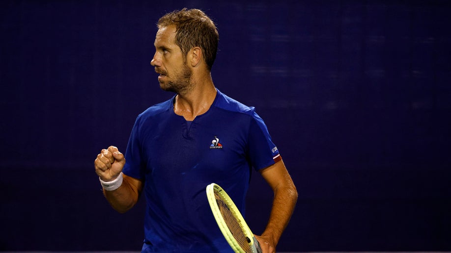 Richard Gasquet of France reacts following a point against Laslo Djere of Serbia during their quarterfinals match 