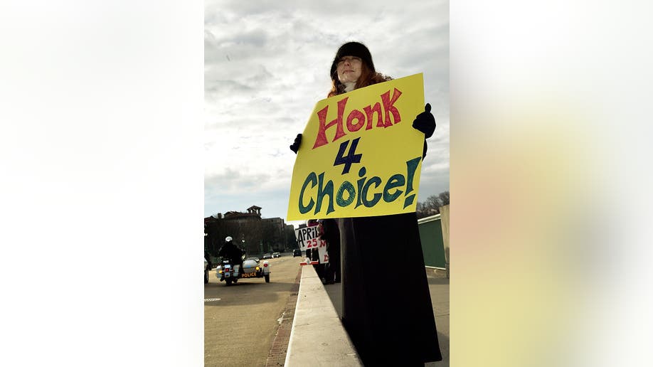 Woman holds pro-choice sign at rally