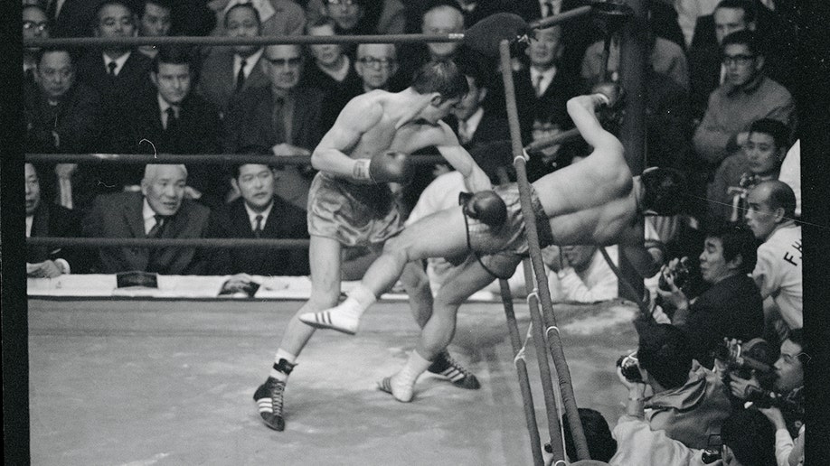 A photo of Johnny Famechon knocking out his opponent