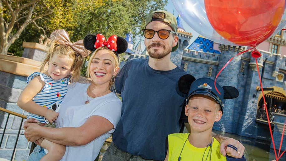 Hilary Duff at Disneyland with her husband Matthew Koma and her kids Banks Violet Bair and Luca Cruz Comrie.