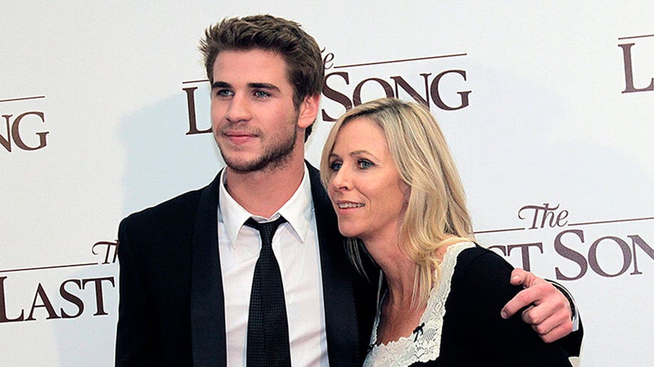 Liam Hemsworth with his mom Leonie Hemsworth in 2010