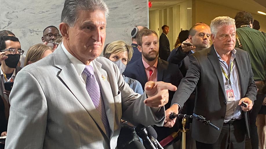 Manchin points at a reporter