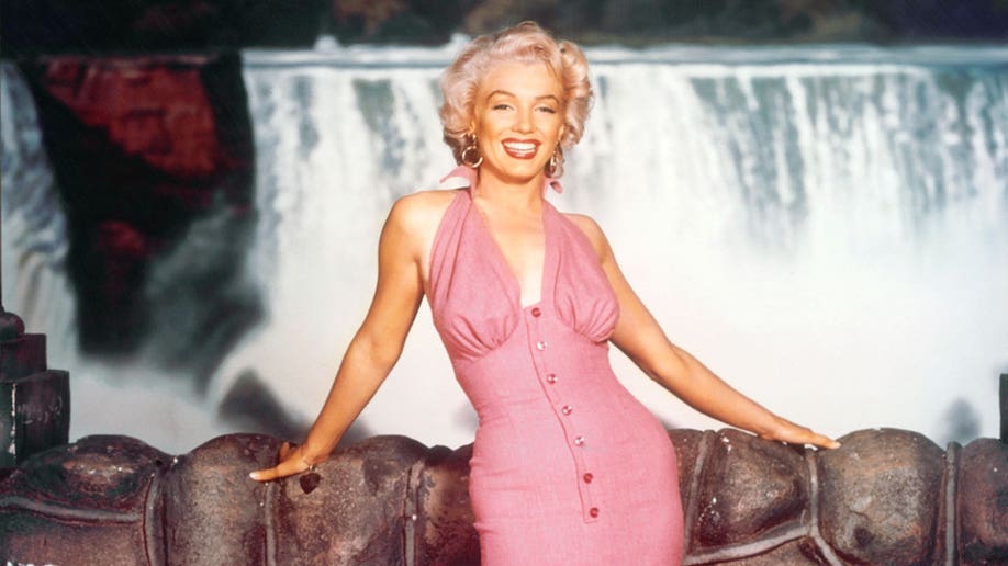 Marilyn Monroe wearing a pink dress on the 