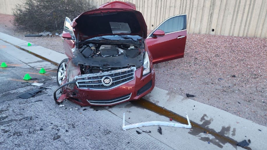 Cadillac after AXDPS trooper rams into it